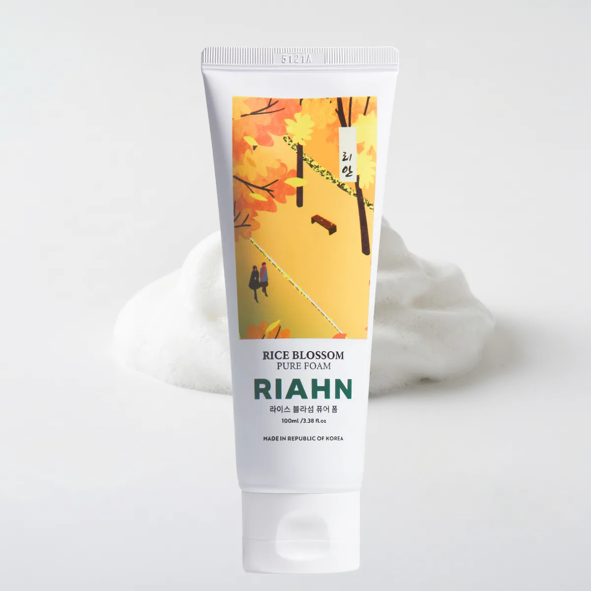 Rice Blossom Pure Foam: a tube standing in a drift of white foam, its autumn label art above.